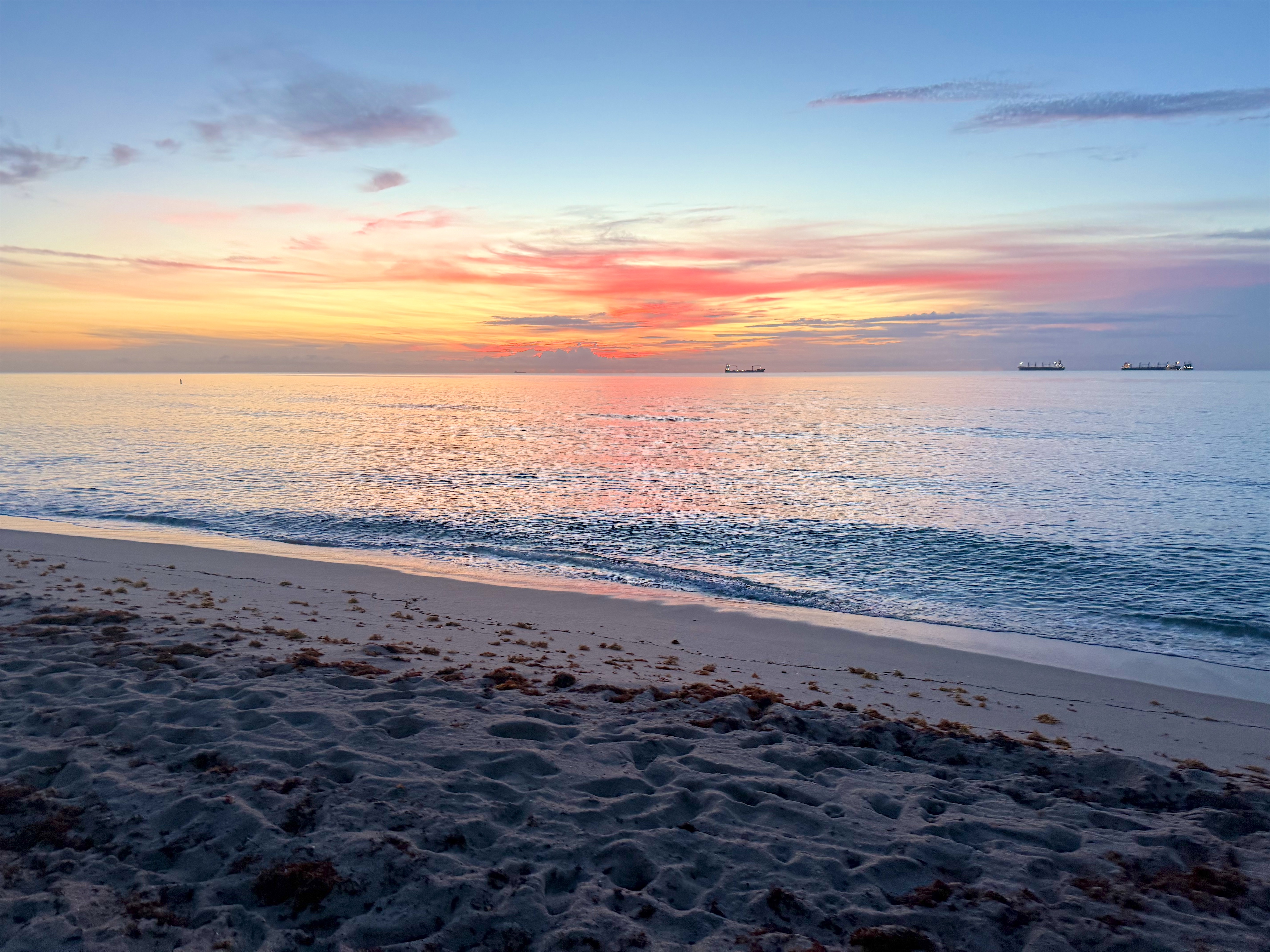 A pink and orange sunrise over the ocean